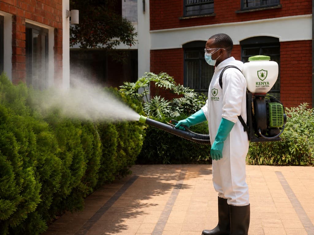 A Nexora pest control technician treating a Nairobi home